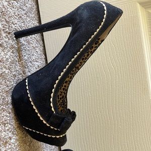Black and white suede high heeled shoes